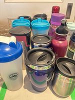 Group showing full assortment of mugs and bottles