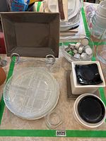 Overview of plates, platter, rack, square dishes, votive holder and tealight bowl
