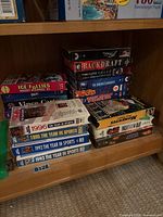 Shelf view showing multiple VHS stacks including Year in Sports series and Ice Follies