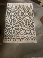 Top view of gray and cream floral rug
