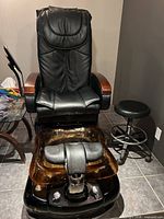 Full view of pedicure chair, basin, and stool