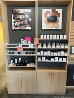 Front view of both shelving units showing adjustable shelves, back panels, and signage frames