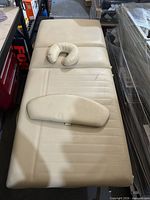 top view of massage table with face cradle and armrest pad
