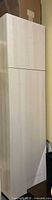 Closed view of tall light maple cabinet