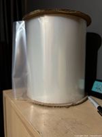 Roll of clear polyethylene bags standing on edge