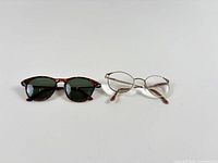 Both pairs of glasses side by side