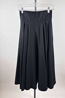 Full view of black pleated wool maxi skirt on hanger