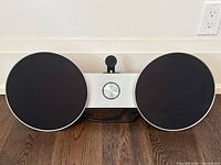 Front view of BeoSound 8 speaker dock showing both speaker grilles