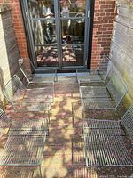 Top view of all six stackable metal wire lounge chairs arranged on deck