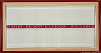 Front view of framed textile showing full design and frame