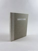 Book in slipcase standing upright showing spine and cover label