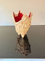 Front view of textured Lava Vase showing red interior
