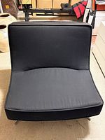 Front view of black Ligne Roset Pop chair