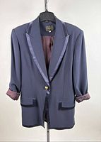Front view of Louben navy tuxedo jacket on hanger