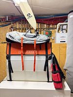 ORU kayak folded in case with straps, paddle, life jacket, accessory pouch