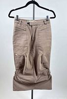 Front view of taupe Parasuco cargo skirt on hanger