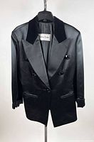Front view of double-breasted black blazer showing buttons, lapels, pockets