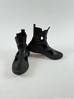 Front and side view of both sneakers showing cut-out design and overall style