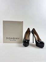 Pumps displayed with Yves Saint Laurent box