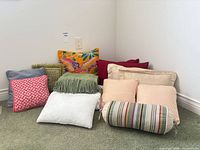 Group shot of all nine pillows against wall