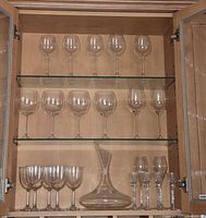 Cabinet view showing all stemware and decanter