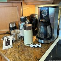 Group shot of all appliances and mug on countertop