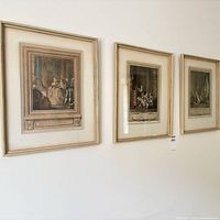 Three framed prints hanging on wall