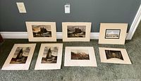 All seven unframed etchings laid out for size and subject overview