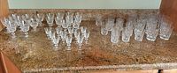 Full lot showing groups of stemware and tumblers on countertop