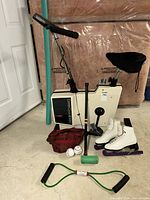Group view of exercise bike and assorted sports items