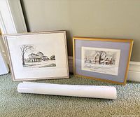 Two framed prints and rolled print shown together