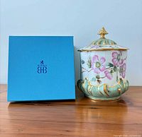 Jar beside Birks blue box showing floral design and size