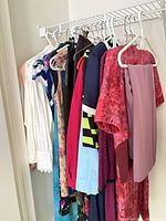 Rack of assorted women’s garments on hangers
