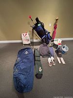 Full lot overview showing bag, clubs, shoes, travel cover, accessories