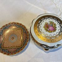 Trinket dish with lid and decorative plate side by side