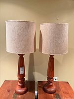 front view of both wooden table lamps with shades
