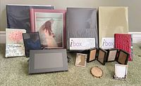 Group shot of all albums, storage boxes, digital frame and small frames