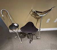 Three portable seats standing open showing styles