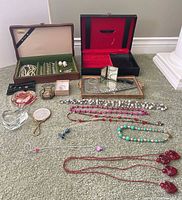 All items laid out including jewelry boxes, tray, ornaments, costume jewelry