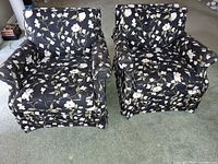 Front view of both matching floral armchairs