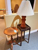 Square table, round table, and lamp grouped together