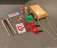 overview showing wagon, bats, cards, bubble bottles, scoop paddles, balls, beads, Spirograph