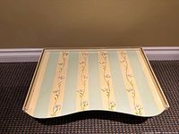 Top view of tray showing hand-painted striped floral design and curved edge