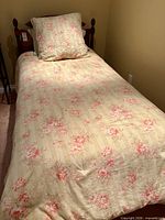 Full view of bed with floral bedding
