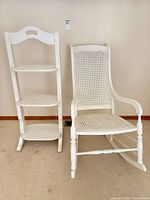 Full view of ladder shelf and rocking chair side by side