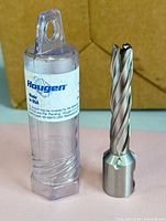Cutter beside labeled clear plastic case
