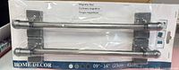 Front view of packaged pair of silver magnetic rods with mounting bases