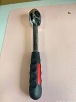 Full view of ratchet wrench front showing grip and head