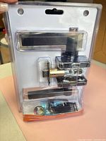 Alternate angle of packaged lever set showing contents