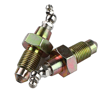 Two grease valves loose showing steel construction and finish